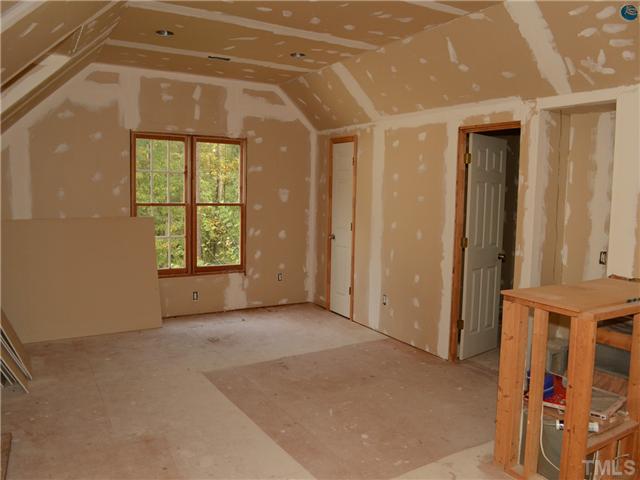 4516 Emmit Drive Raleigh, NC 27604 - Photo 7 of 13 an empty room with windows