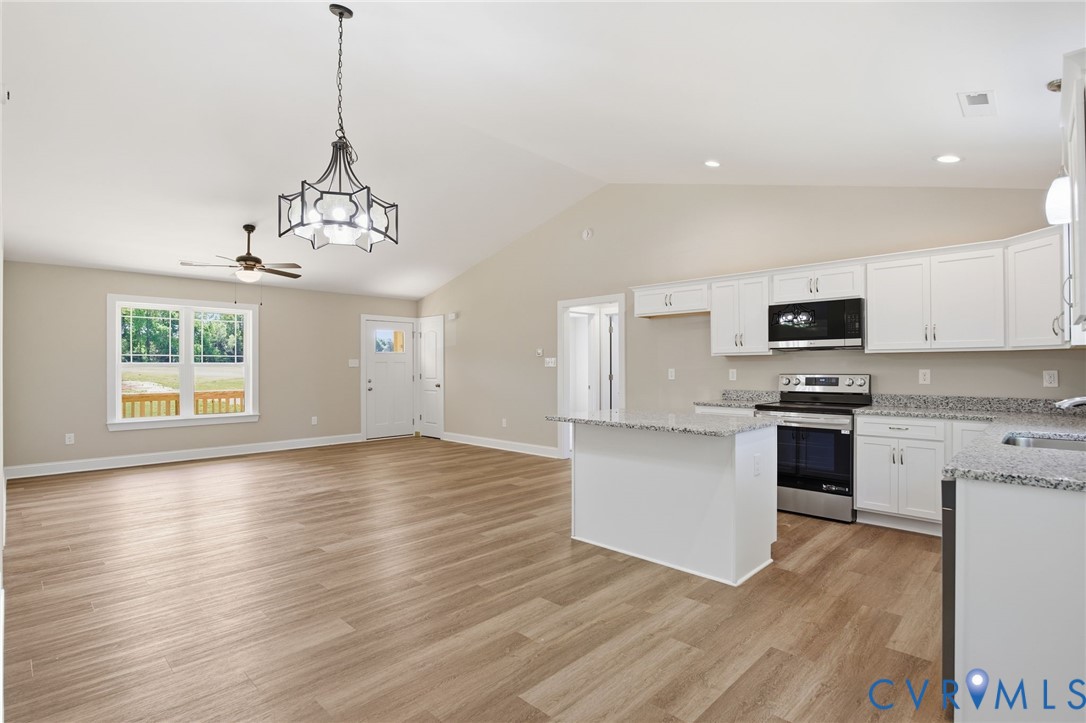 17557 Hewlett Road Beaverdam, VA 23015 - Photo 12 of 29 a view of a kitchen with microwave and stove