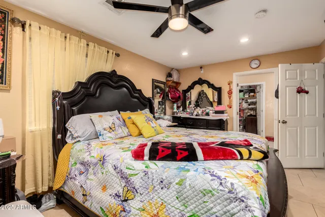 a bedroom with a bed and a walk in closet