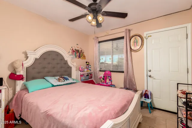 a bed room with a bed and a chandelier