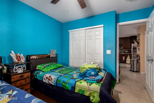 a bedroom with a bed and a dresser