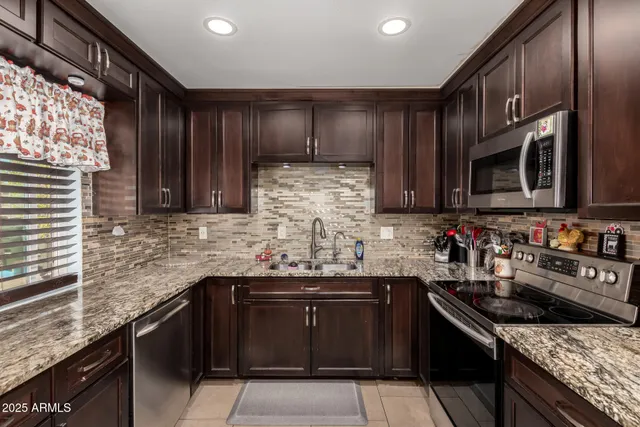 a kitchen with a sink and a stove