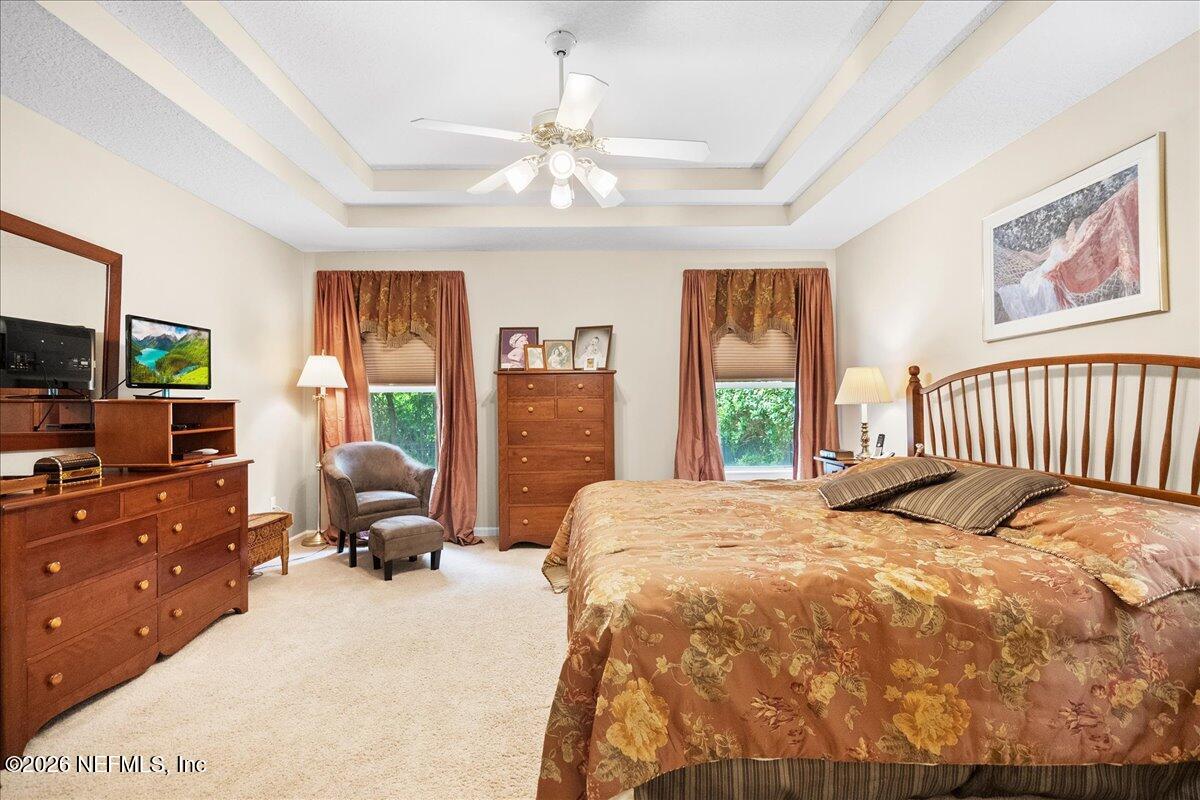 2489 Tall Cedars Road Fleming Island, FL 32003 - Photo 21 of 72 a bedroom with a bed and window