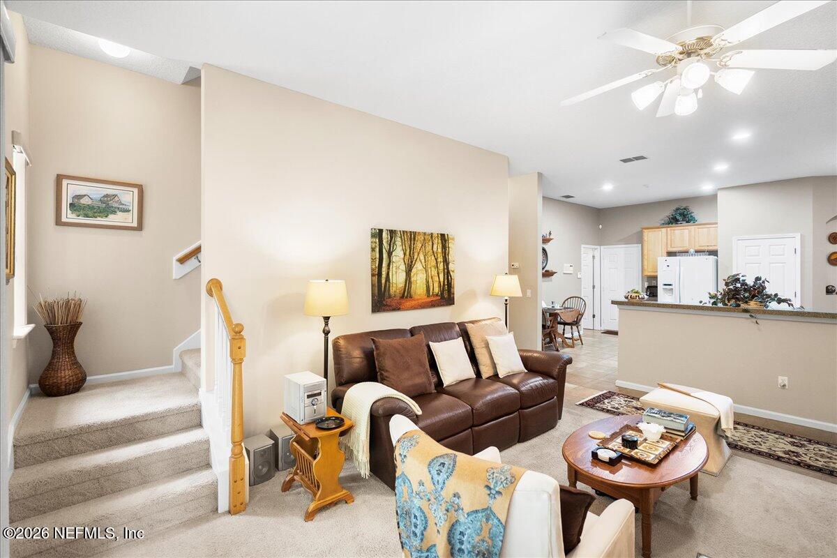 2489 Tall Cedars Road Fleming Island, FL 32003 - Photo 27 of 72 a living room with furniture and a table