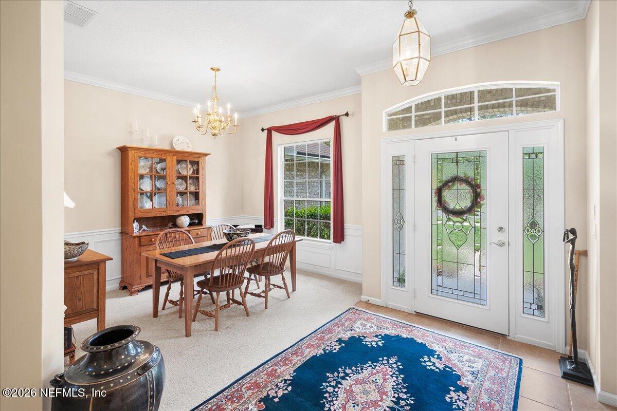 2489 Tall Cedars Road Fleming Island, FL 32003 - Photo 4 of 72 a view of a livingroom with furniture window and outside view