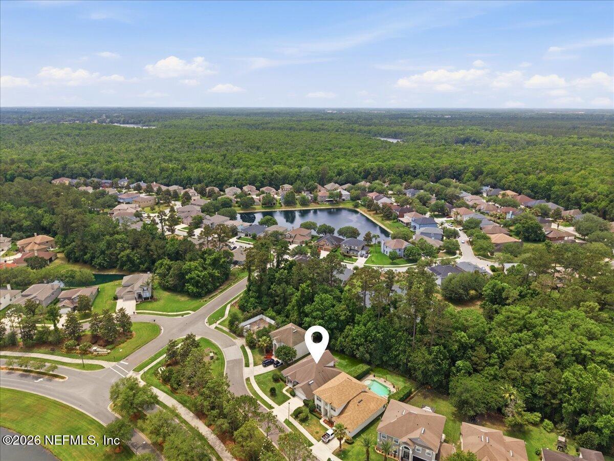 2489 Tall Cedars Road Fleming Island, FL 32003 - Photo 42 of 72 an aerial view of a city with lots of residential buildings