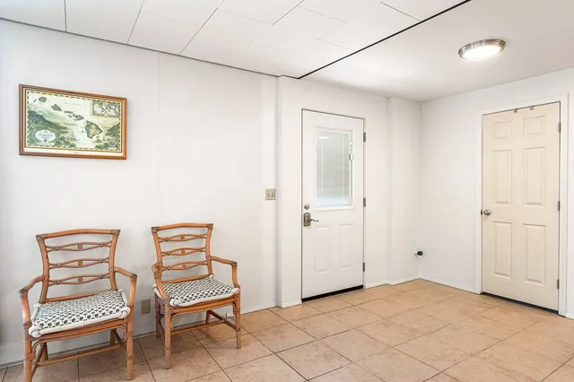 a view of room with lounge chair and windows