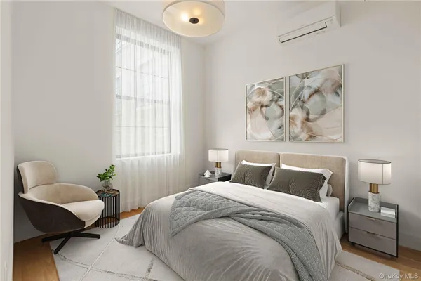 a bedroom with a bed and chair