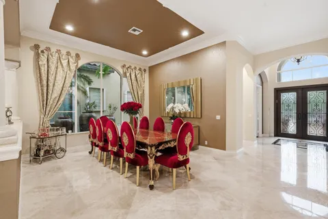 a bathroom with a granite countertop tub sink and mirror