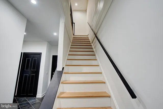 a white toilet sitting next to a sink