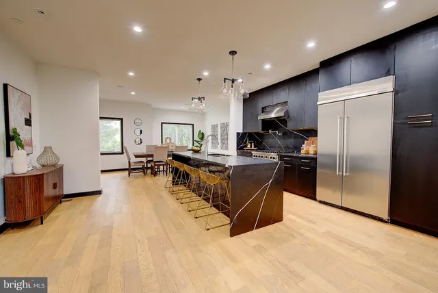 a view of a dining room with furniture and a window