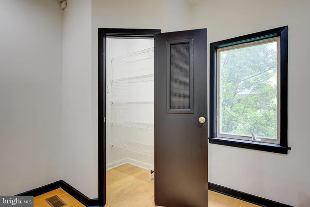 a bathroom with a granite countertop sink and a bathtub