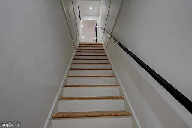 a bathroom with double vanity sinks and a mirror