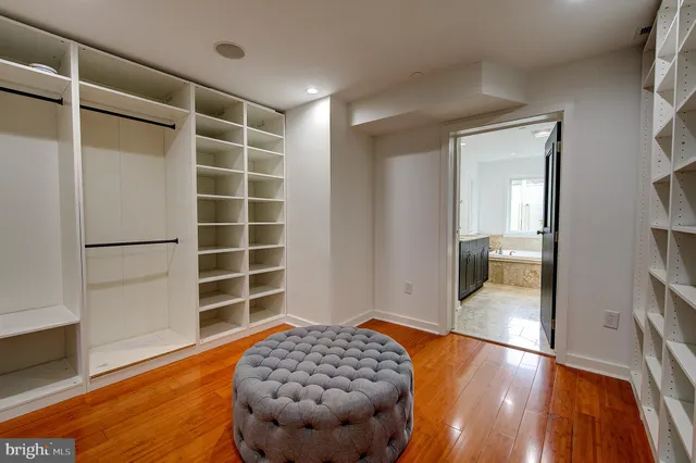 a view of a room with wooden floor and window