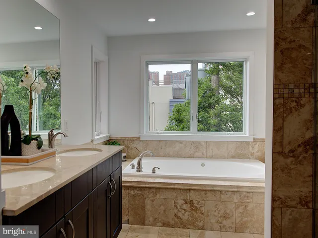 a view of hallway with stairs and wooden floor