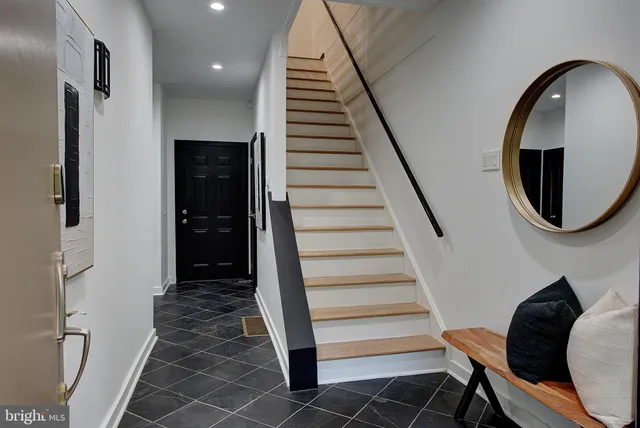 a bedroom with bed and wooden floor