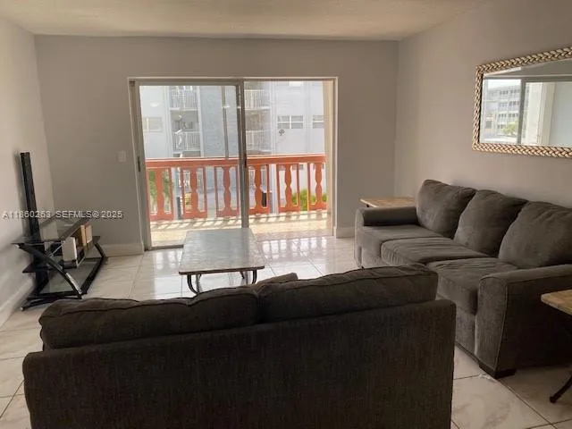 a living room with furniture and a window