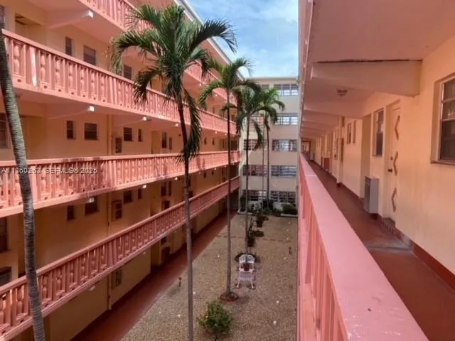 a picture of a building with sitting area