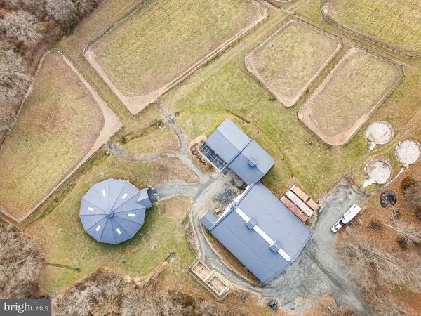 an aerial view of a house with pool