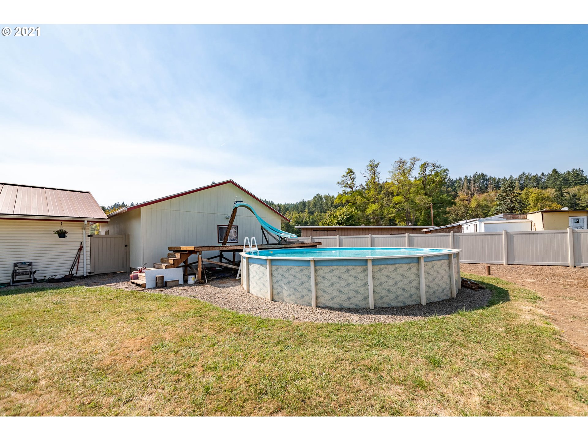 38383 Dexter Road Dexter, OR 97431 - Photo 23 of 32 a view of a chair and table in the backyard