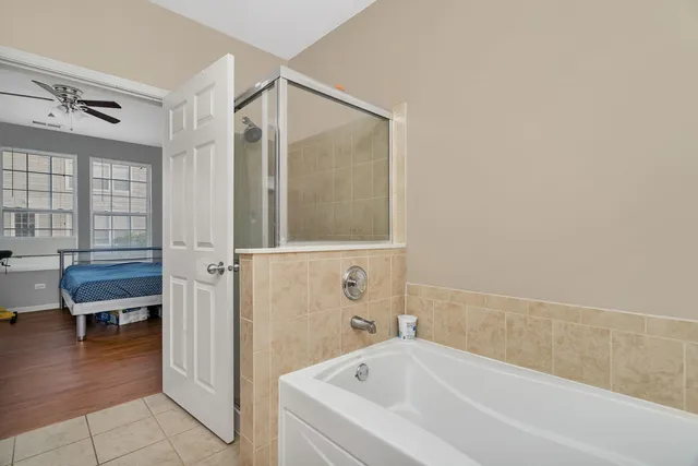 a bathroom with a bathtub and a shower
