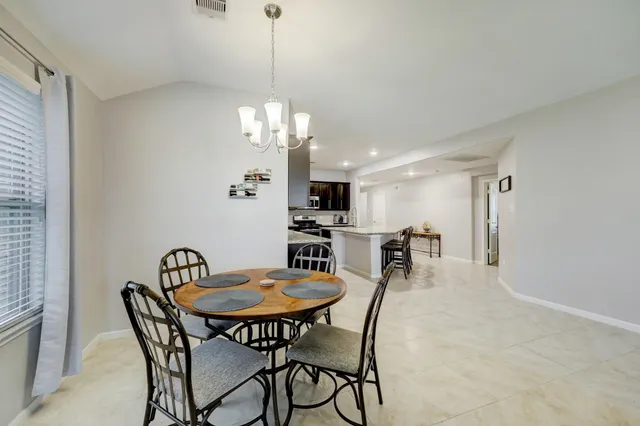 a view of a dining room with furniture