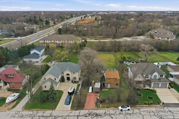 an aerial view of a house with a garden