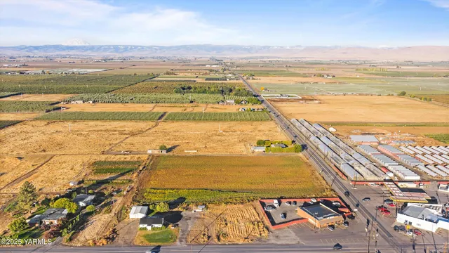 an aerial view of residential building and ocean