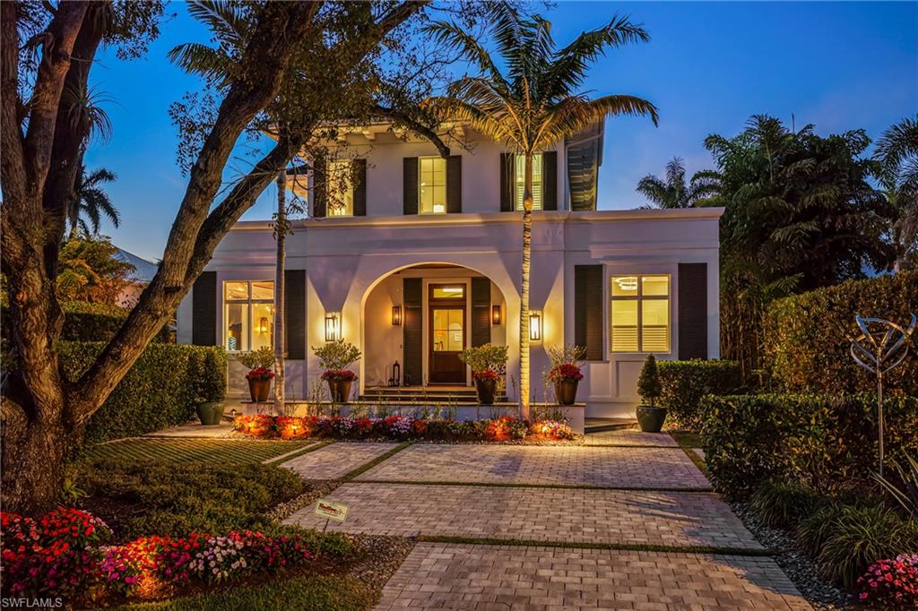 215 3rd Avenue North Naples, FL 34102 - Photo 3 of 47 Twilight front entry of the home.
