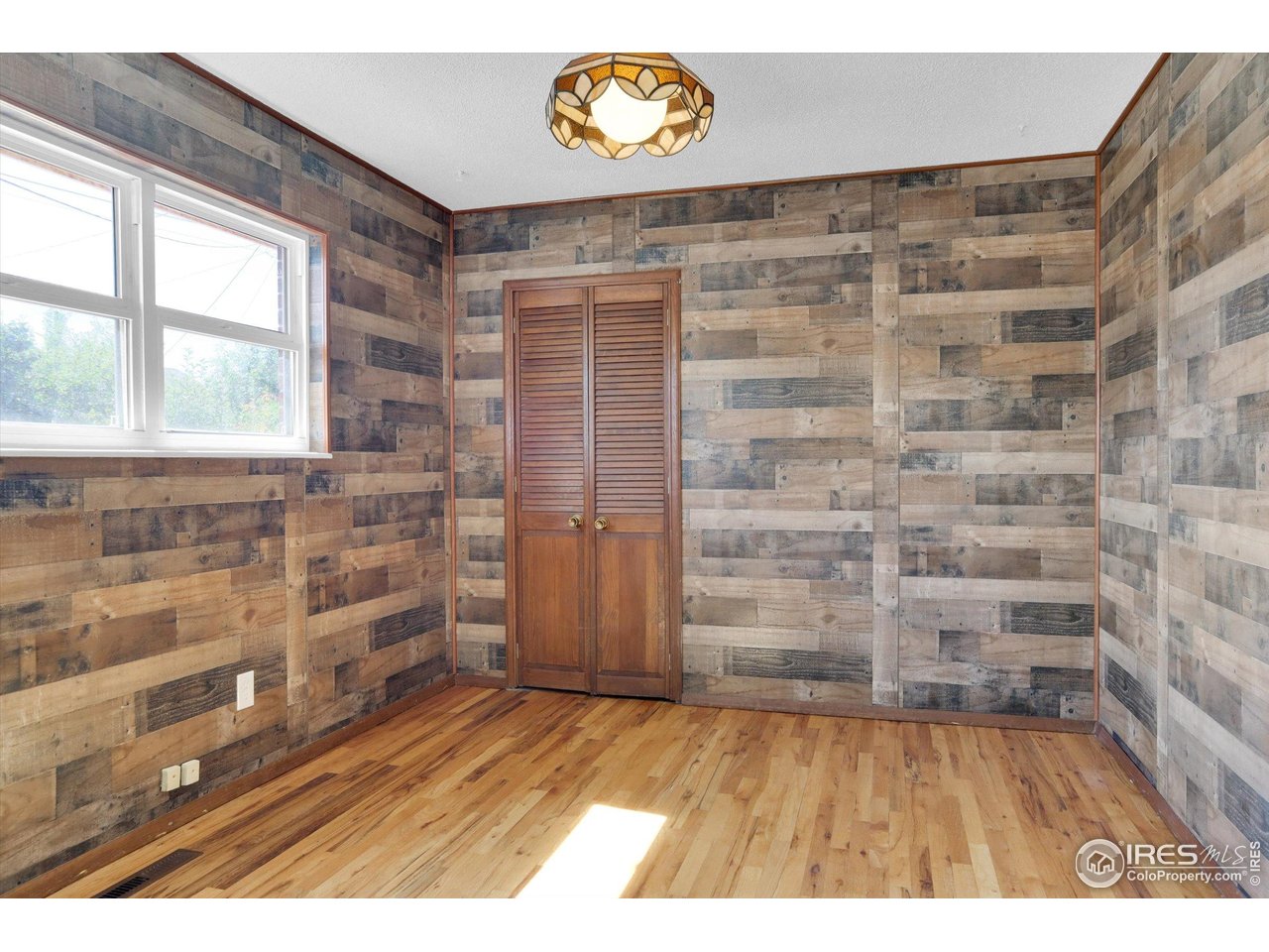 4630 Macky Way Boulder, CO 80305 - Photo 12 of 40 a view of an empty room and wooden floor