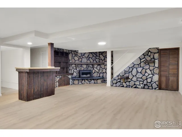 a view of wooden floor with wooden shelves