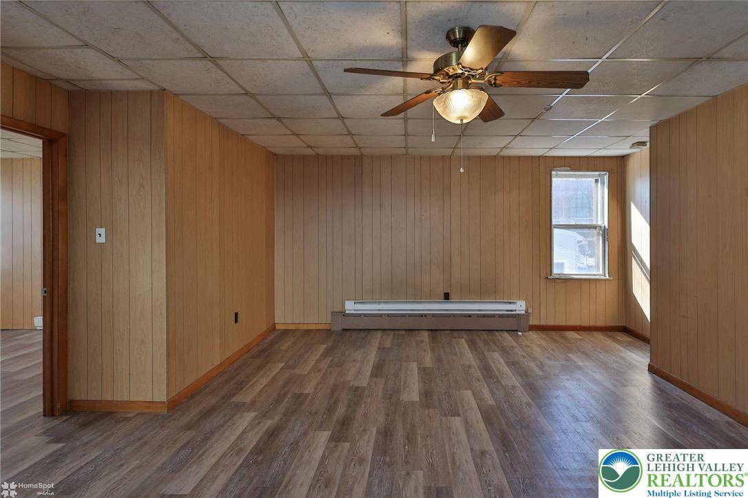 115 East Ruddle Street Coaldale, PA 18218 - Photo 16 of 61 a view of an empty room with wooden floor and a window
