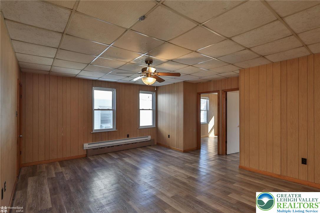 115 East Ruddle Street Coaldale, PA 18218 - Photo 18 of 61 a view of an empty room with wooden floor and a window