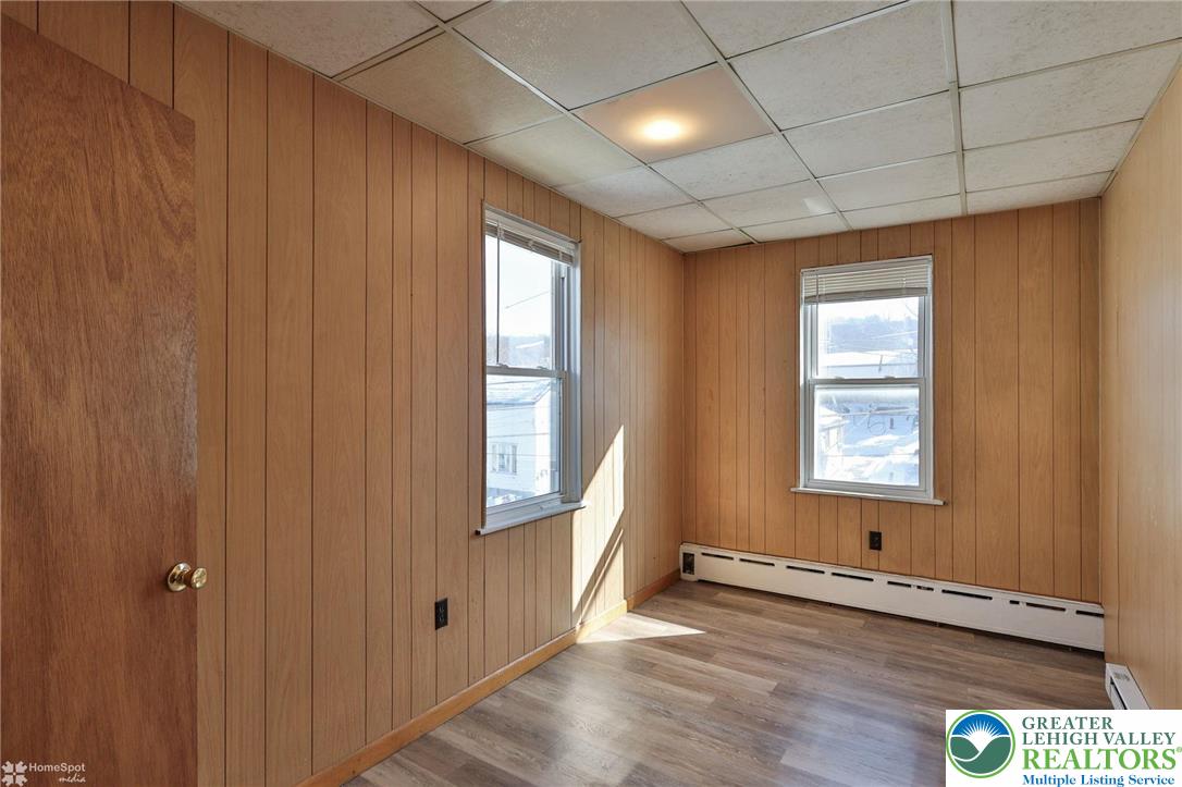 115 East Ruddle Street Coaldale, PA 18218 - Photo 21 of 61 a view of an empty room with wooden floor and a window