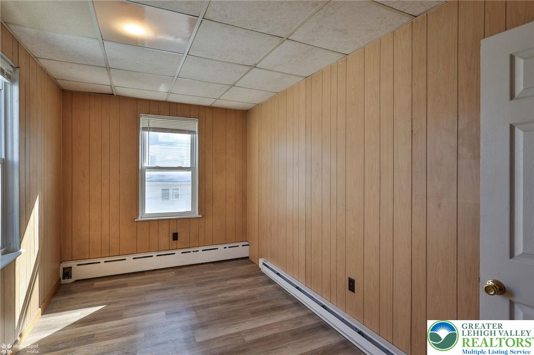 115 East Ruddle Street Coaldale, PA 18218 - Photo 23 of 61 a view of an empty room with wooden floor and a window