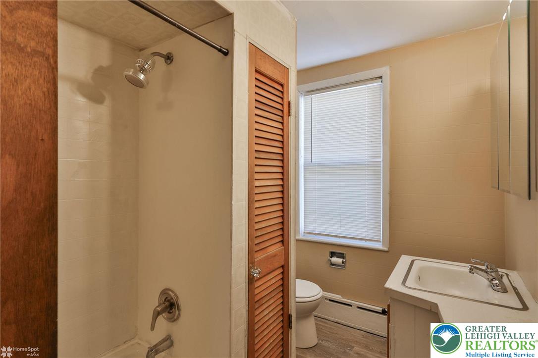 115 East Ruddle Street Coaldale, PA 18218 - Photo 31 of 61 a bathroom with a toilet a sink and a shower