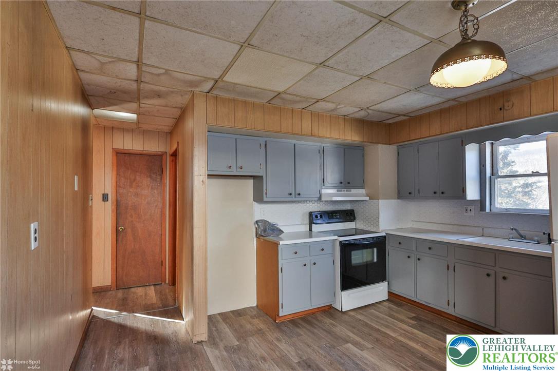 115 East Ruddle Street Coaldale, PA 18218 - Photo 35 of 61 a kitchen with a sink cabinets and wooden floor