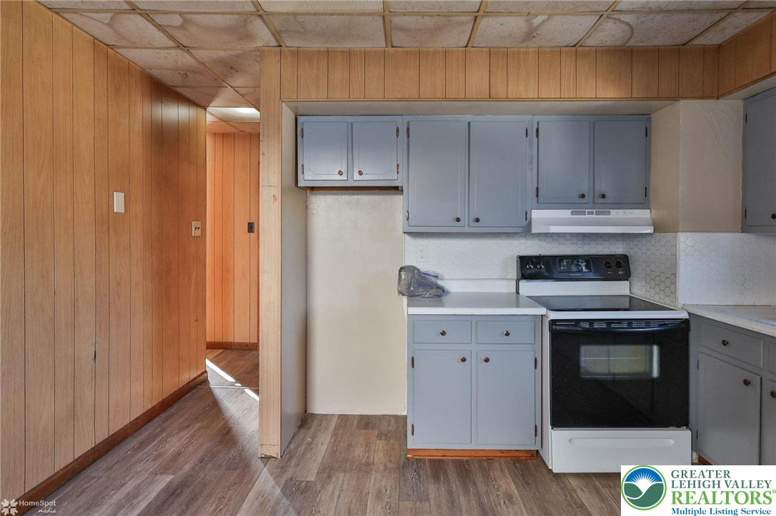 115 East Ruddle Street Coaldale, PA 18218 - Photo 36 of 61 a kitchen with a stove and a refrigerator