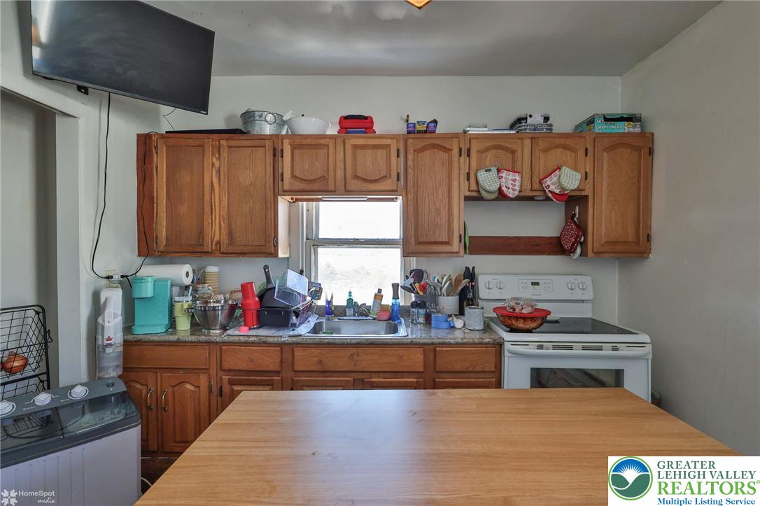 115 East Ruddle Street Coaldale, PA 18218 - Photo 40 of 61 a kitchen with lots of counter top space and wooden floor