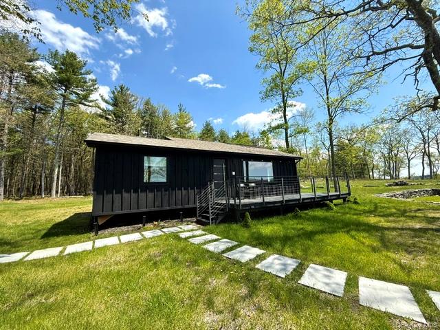 125 Mapes Road Barryville, NY 12719 - Photo 20 of 37 a view of a house with a yard
