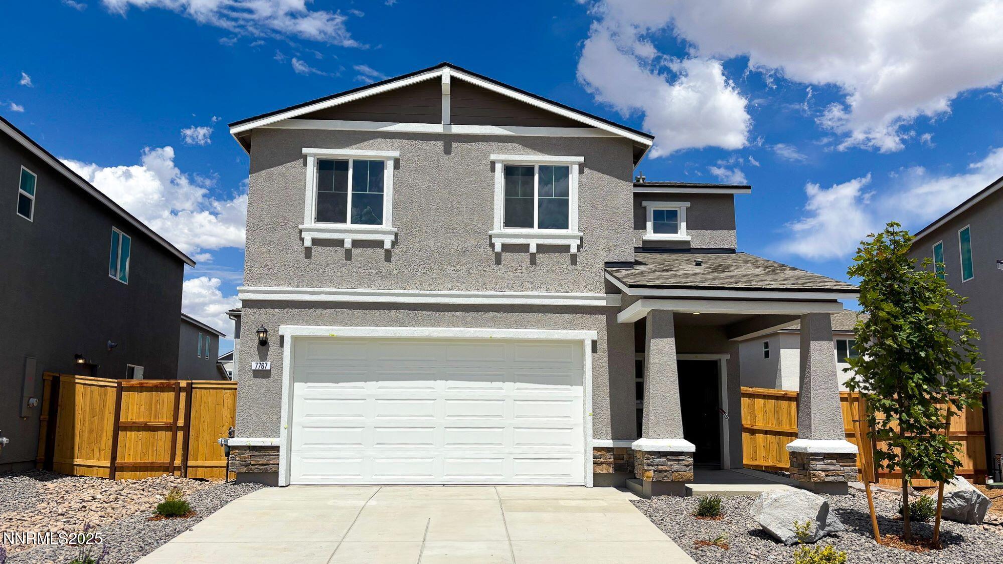7767 Lone Prairie Road, Unit LOT #177 Reno, NV 89506 - Photo 1 of 21 a front view of a house with a yard