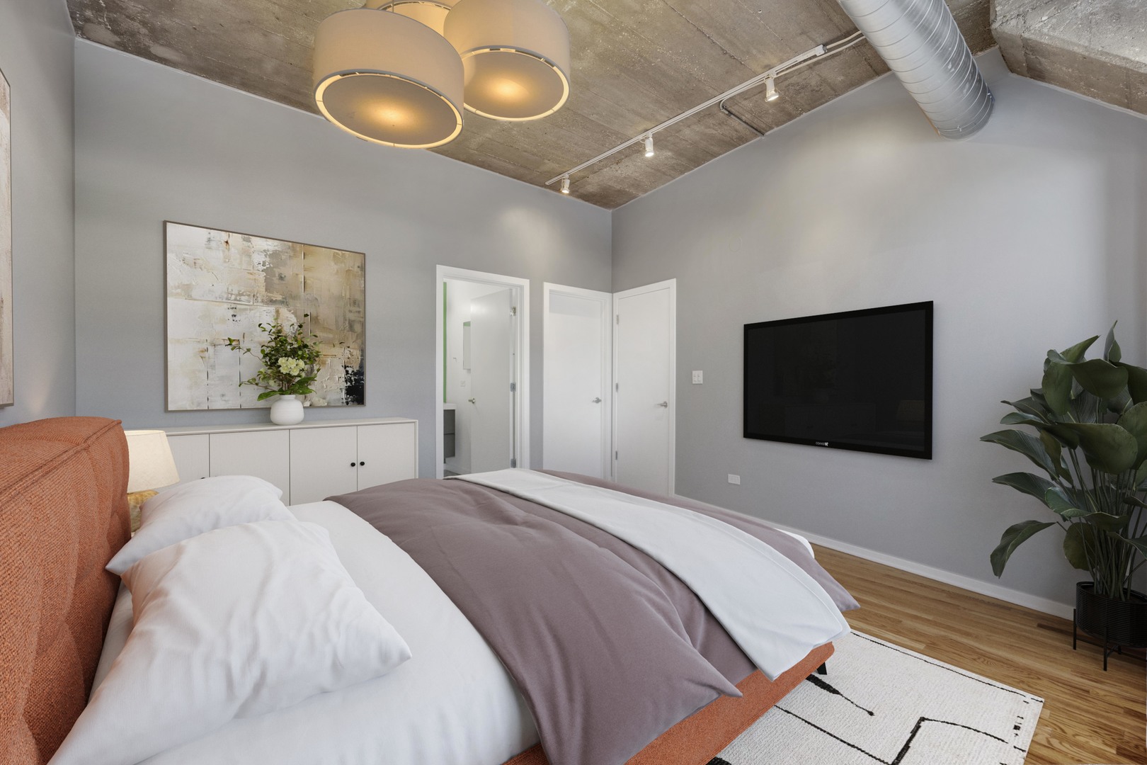 1111 West 15th Street, Unit 224 Chicago, IL 60608 - Photo 16 of 71 a bedroom with a bed and a potted plant