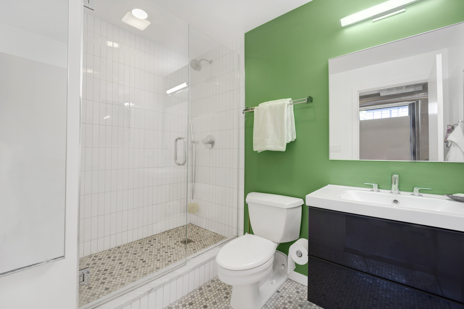 1111 West 15th Street, Unit 224 Chicago, IL 60608 - Photo 17 of 71 a bathroom with a sink toilet and shower