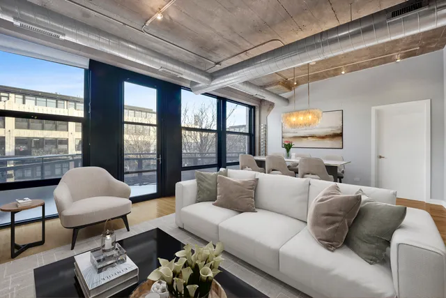 a kitchen with stainless steel appliances a refrigerator and wooden floor