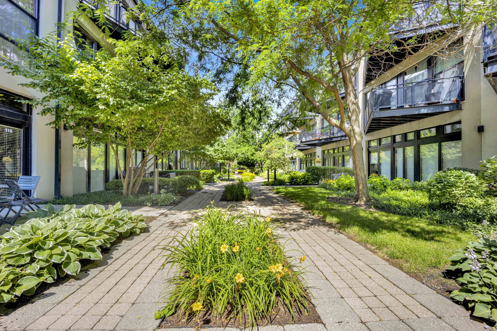 1111 West 15th Street, Unit 224 Chicago, IL 60608 - Photo 26 of 71 a front view of a house with a yard