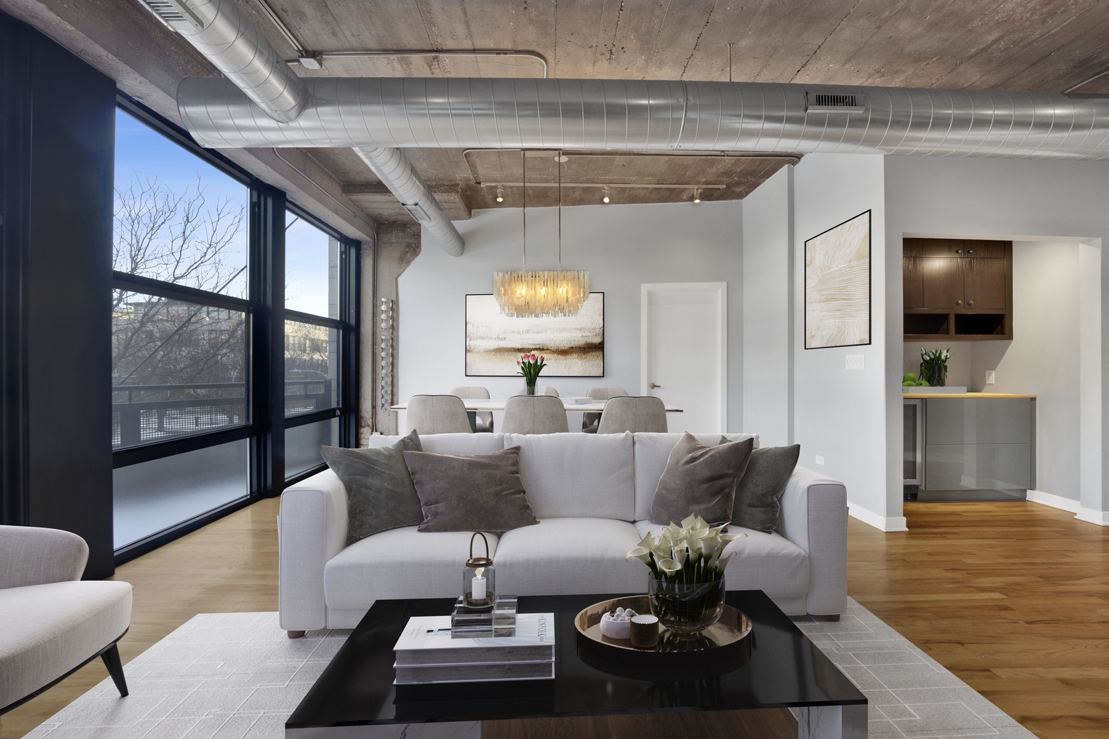 1111 West 15th Street, Unit 224 Chicago, IL 60608 - Photo 3 of 71 a living room with furniture and a chandelier