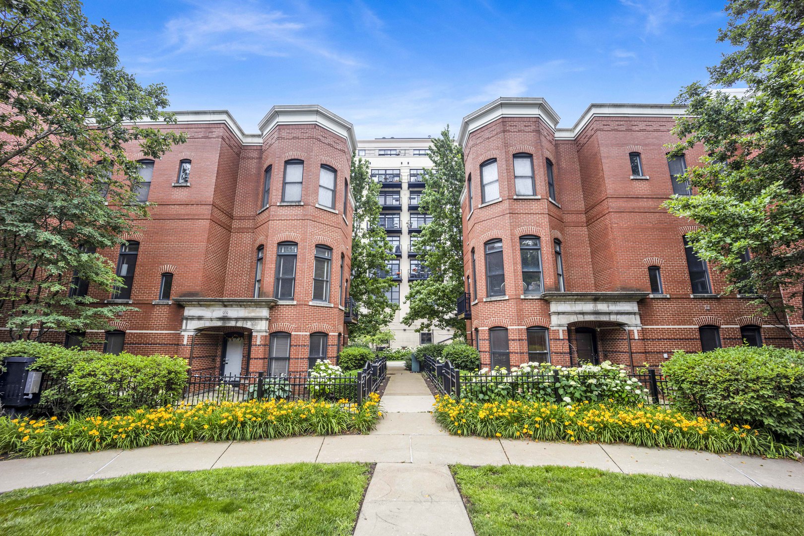 1111 West 15th Street, Unit 224 Chicago, IL 60608 - Photo 46 of 71 front view of a brick building next to a yard