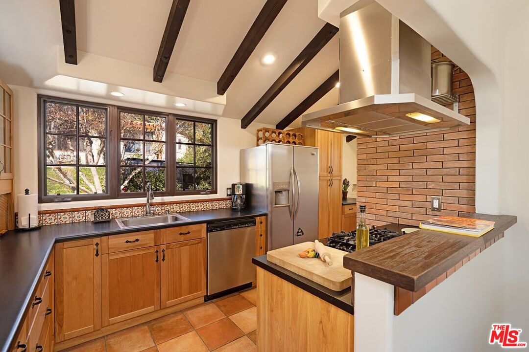 3932 Roderick Road Los Angeles, CA 90065 - Photo 14 of 43 a kitchen with stainless steel appliances granite countertop a sink stove and refrigerator