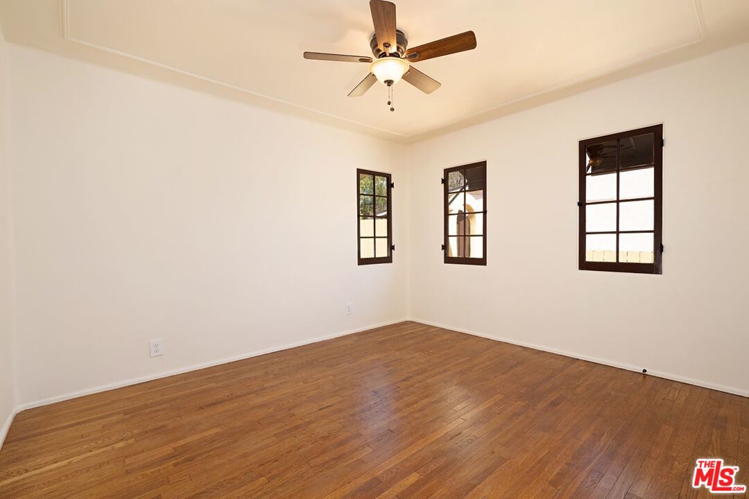 3932 Roderick Road Los Angeles, CA 90065 - Photo 20 of 43 a view of empty room with wooden floor and fan