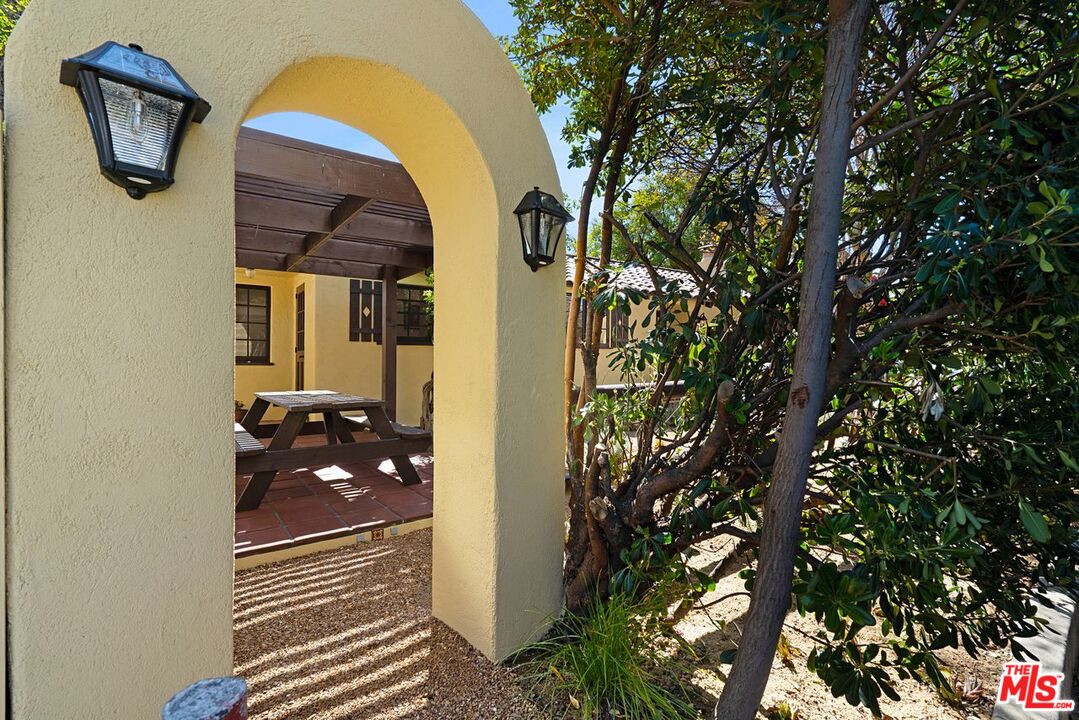 3932 Roderick Road Los Angeles, CA 90065 - Photo 3 of 43 a backyard of a house with barbeque oven and glass windows